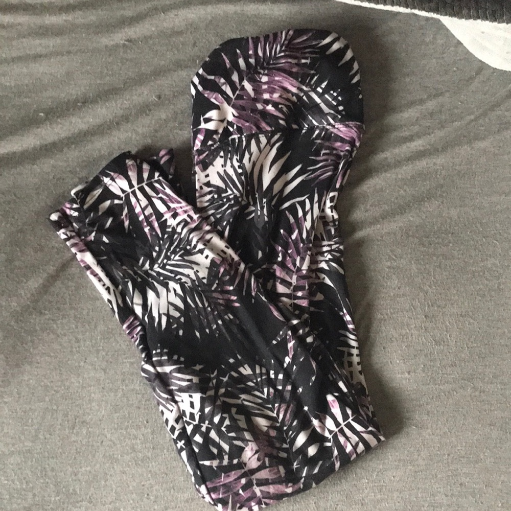 Soft leggings, black leggings with purple and white leaves on it, comfy.
